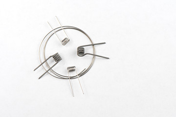 Simple and Clapton Coil inside wire of cantal on white Background, isolated. frontal