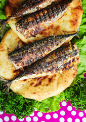 Serving fried fish with greens