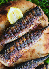 Serving fried fish with greens