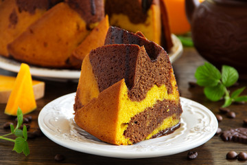 Pumpkin chocolate cake with frosting.