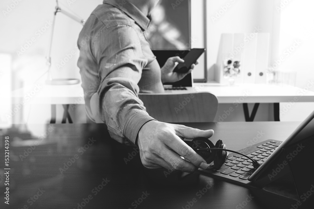 Poster businessman using VOIP headset with digital tablet computer and smart phone,as concept communication and call center or customer service help desk in modern office