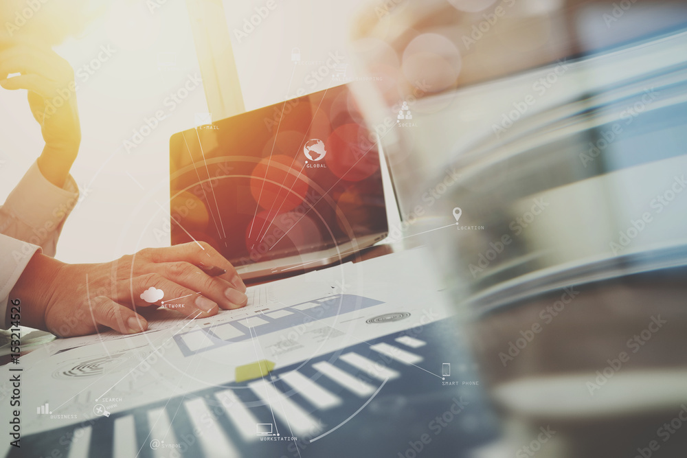 Poster businessman working with mobile phone and digital tablet and laptop computer on wooden desk in moder