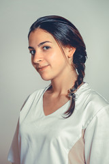 Fototapeta premium Close up Portrait Of Masseur In Spa Salon. Beautiful young white woman doctor looking at camera. Physical Therapist. Beauty Treatment, Massage Therapy. Healthcare, Medicine Concept. Wellness