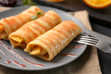 Plate with delicious pancakes and syrup, closeup