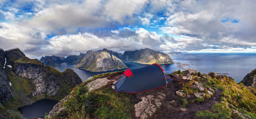 Tent on top of Reinebringen, Lofoten Islands,Northern Norway.  Wild camping - obrazy, fototapety, plakaty