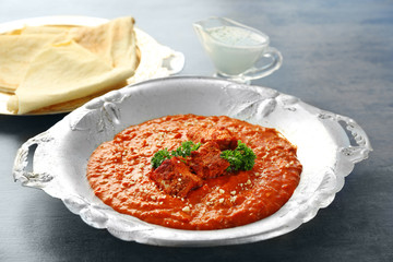 Delicious Murgh Makhani in metalic plate on table