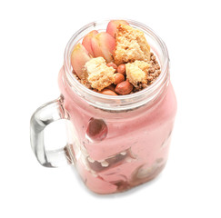 Delicious parfait with fruits in jar on white background