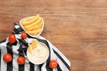Composition with tasty mayonnaise sauce on wooden table