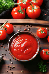 Delicious ketchup in bowl with ingredients on tray, top view