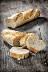 Sliced baguette on a wooden table