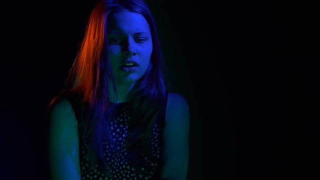 Scared teen girl with in dark