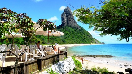 Chilling around in praia Conceio, on of the best beaches in Fernando Noronha, Brazil - obrazy, fototapety, plakaty