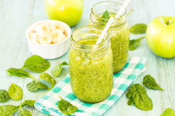 Green Spinach Vegetable and Fruit Smoothies With Apples and Banana