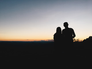 Fototapeta na wymiar Silhouette couple in mountain