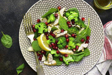 Vegetable green salad with chicken and pomegranate.Top view.