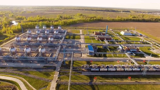 tank farm for bulk petroleum and gasoline storage next to rail line. Aerial view