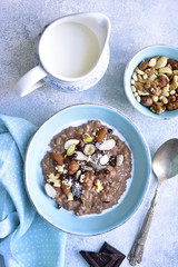 Chocolate oat porridge with nuts.Top view.