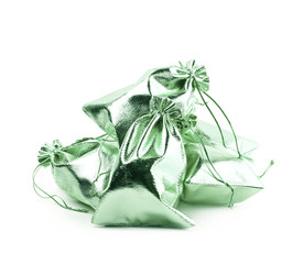 Pile of cloth gift bags isolated