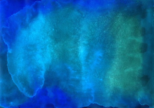 Blue background painted in watercolor by hand on wet textured paper
