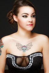 Beautiful young woman in mysterious Venetian mask