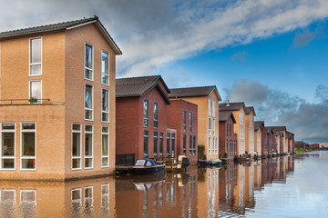 Fototapeta na wymiar Modern Houses built in the Water in a row