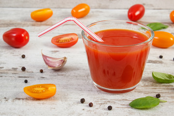 Tomato juice and vegetables with spices, concept of healthy nutrition