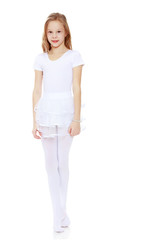 Little gymnast in a white suit.