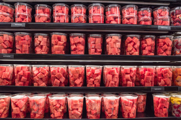 Fresh chopped and chunks fruits plastic box display in local store at Houston, Texas, US. In-house...