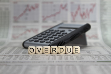 overdue word built with letter cubes