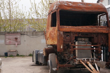 Rusty truck - a tractor after a fire and accident