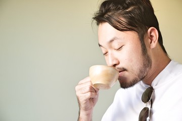 Man is smelling coffee