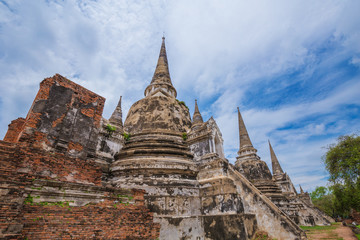 Fototapeta premium Ruins of buddha statues and pagoda of Wat Phra Si Sanphet in Ayutthaya historical park, Thailand