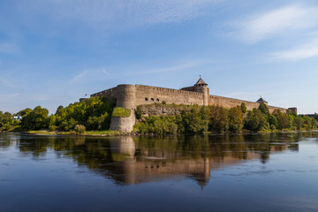 Fototapeta na wymiar Ivangorod medieval fortress on the river Narva, Estonia and Russia border. Summer day view.
