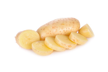 whole and sliced raw unpeeled potato on white background