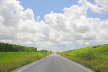 Stock Photo - panoramic color view of nice summer empty country  road