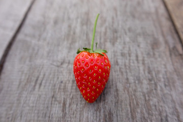 Fresh strawberry on wooden background. 