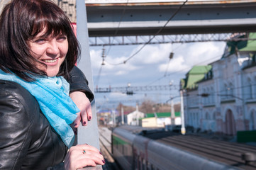 Woman waiting for the train at train station