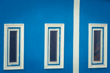 Windows On Wall / Three Windows On Vintage Blue Wall Background.
