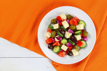 delicious Greek salad on white plate