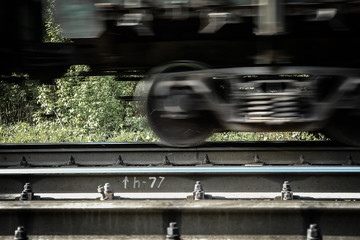 Fototapeta premium Railway carriage on rails, moving, blured by low shutter speed.