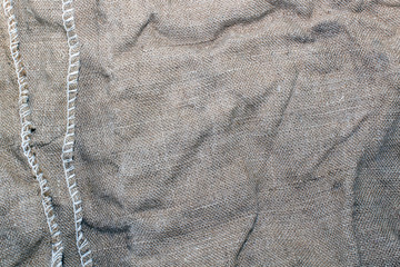 Texture of an old dirty potato sack