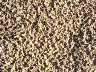 closeup of sand pattern of a beach in the summer
