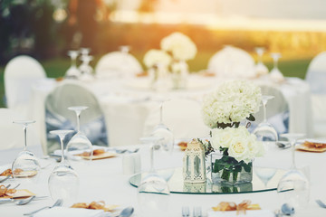 Dinner table setting on the beach for wedding celebrate.