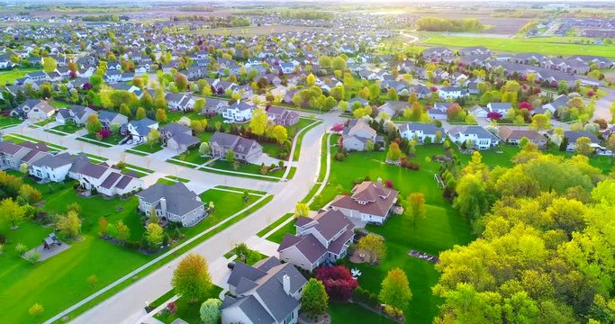 Exceptionally beautiful suburban neighborhoods, homes, aerial view at sunrise.
