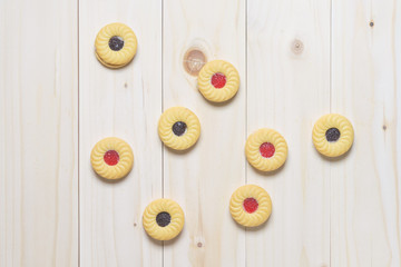 Cookie biscuits on wooden table, flat lay