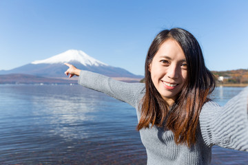 Woman taking selfie in mountain Fuji