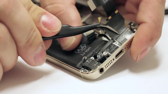 Male master repairing mobile phone
