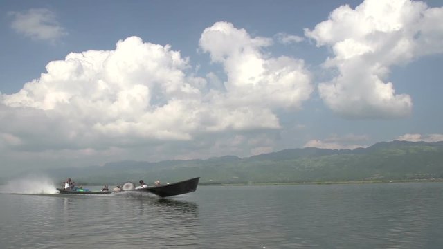 Inle lake, boat passes at high speed