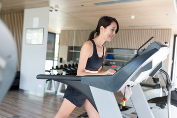 Fototapeta premium Woman training on treadmill