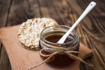 jar of honey with rice cookies
